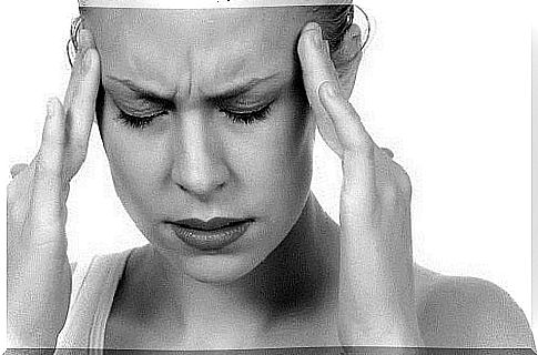 Woman suffering from a migraine