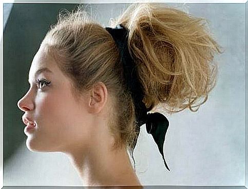 match a hairstyle with a dress: bun with backless dress