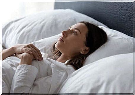 woman trying to get to sleep