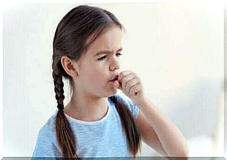 A girl coughing.