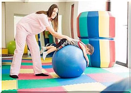 A physiotherapist with a child.